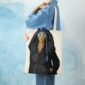 model is wearing tatiana miath's tote bag